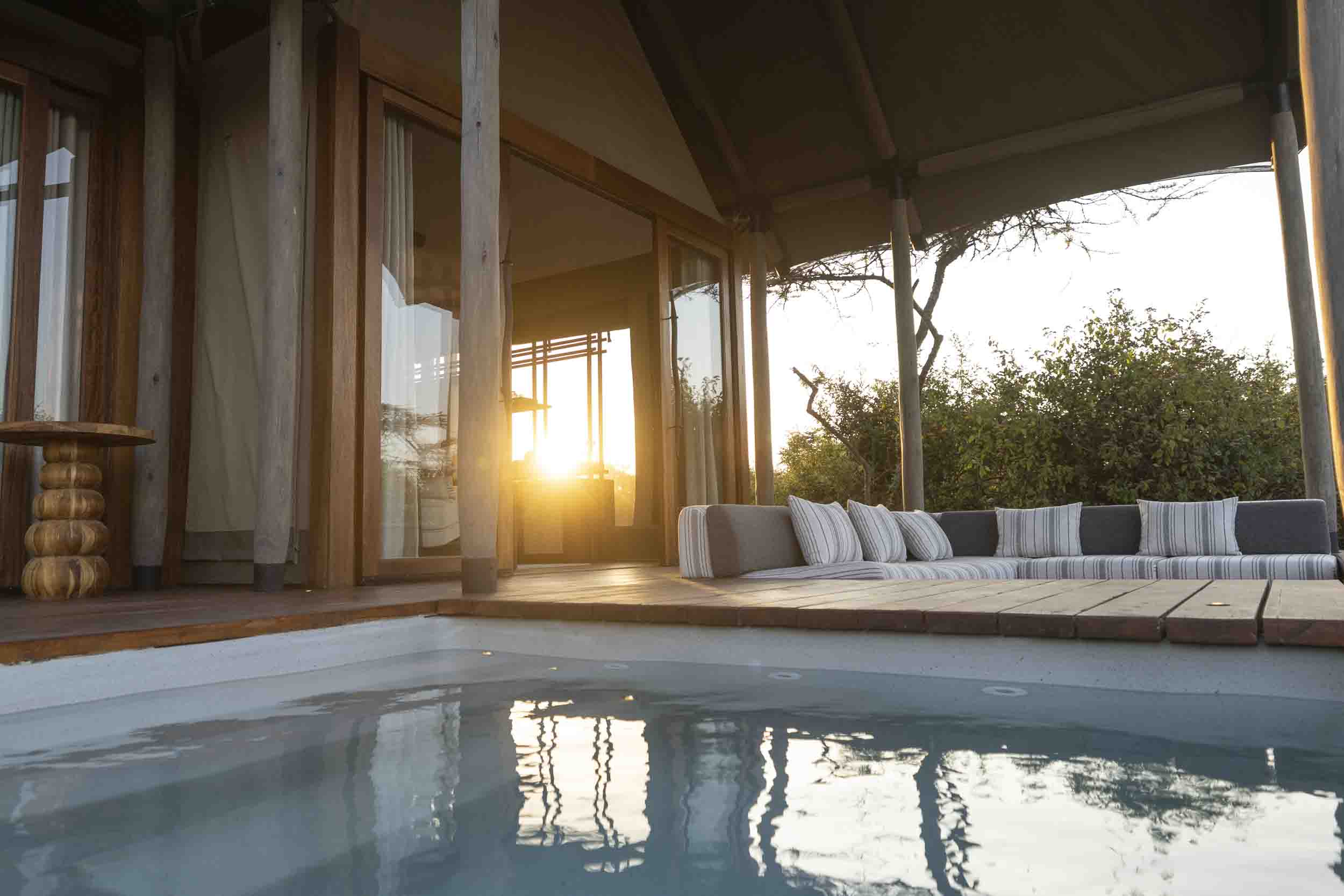 A room and pool at sunset, JW Marriott Mount Kenya Rhino Reserve Safari Camp